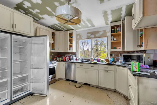 a room with furniture a rug toys and a flat screen tv