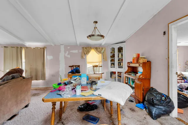 a living room with lots of furniture and a window