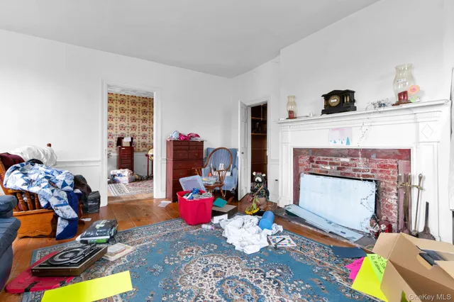 a view of a workspace with furniture and a chandelier