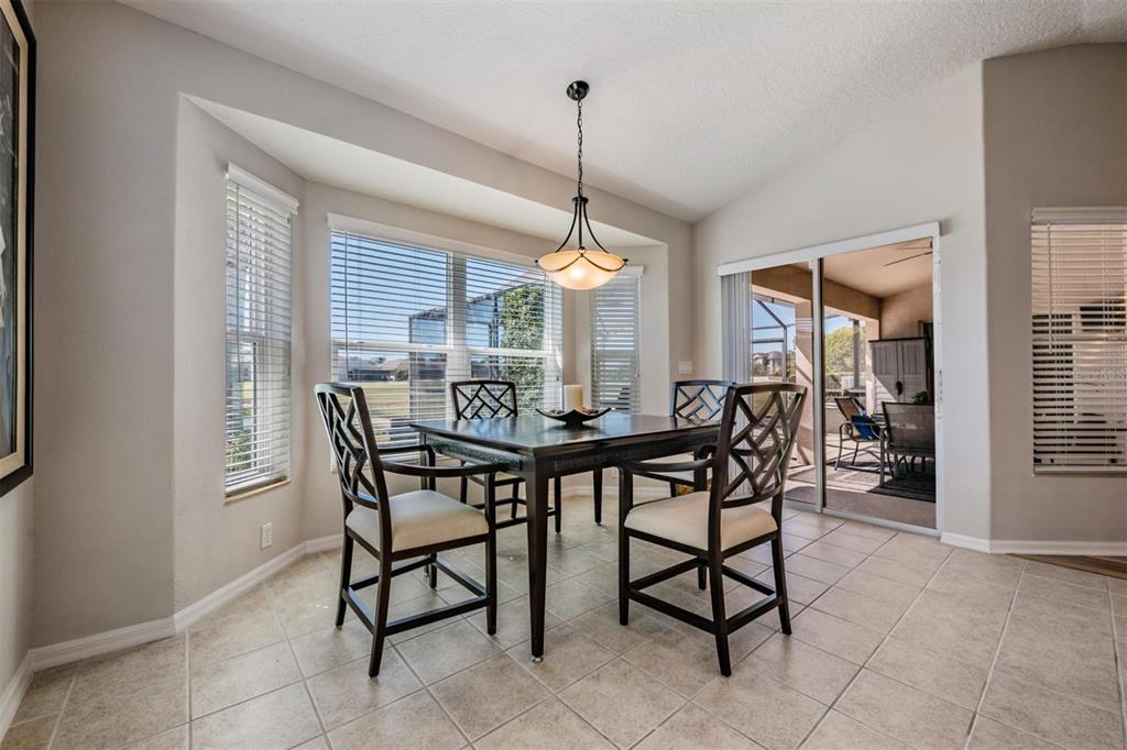 1751 Lakestone Drive Trinity, FL 34655 - Photo 11 of 51 a dining room with furniture and window
