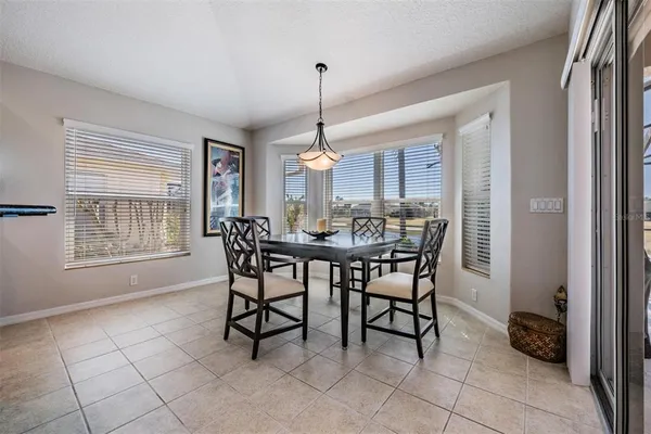 a dining room with furniture and window