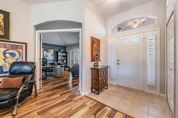 a view of livingroom with furniture and workspace