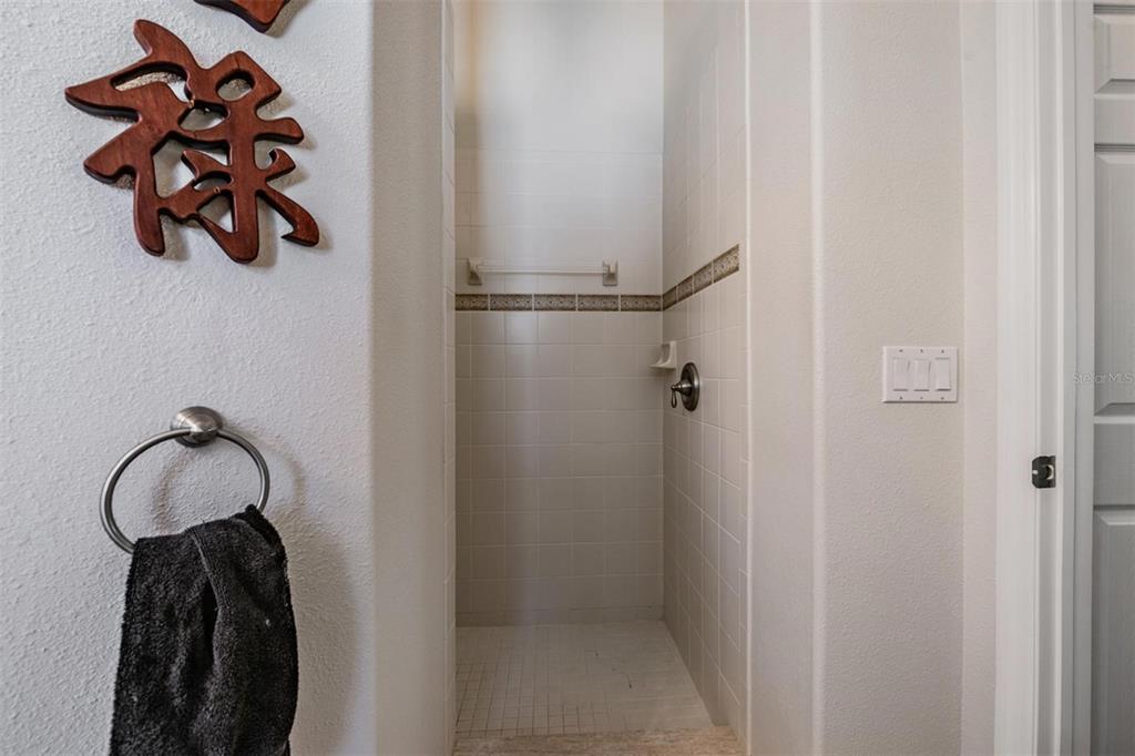 1751 Lakestone Drive Trinity, FL 34655 - Photo 18 of 51 a bathroom with a shower and a vanity