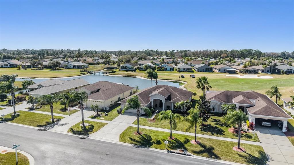 1751 Lakestone Drive Trinity, FL 34655 - Photo 25 of 51 an aerial view of residential houses with outdoor space and lake view