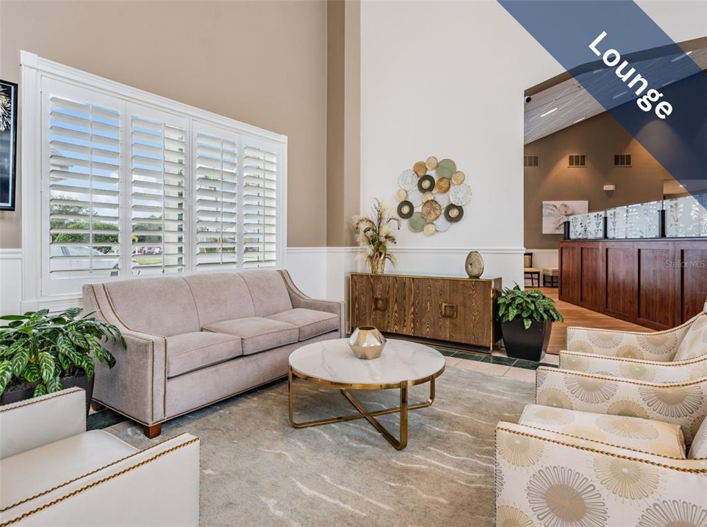 1751 Lakestone Drive Trinity, FL 34655 - Photo 42 of 51 a living room with furniture and a large window