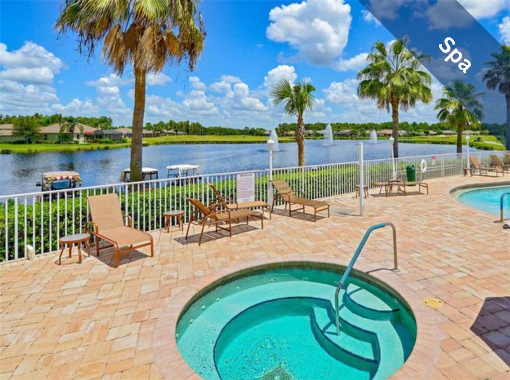 1751 Lakestone Drive Trinity, FL 34655 - Photo 46 of 51 a view of a swimming pool with a lounge chairs