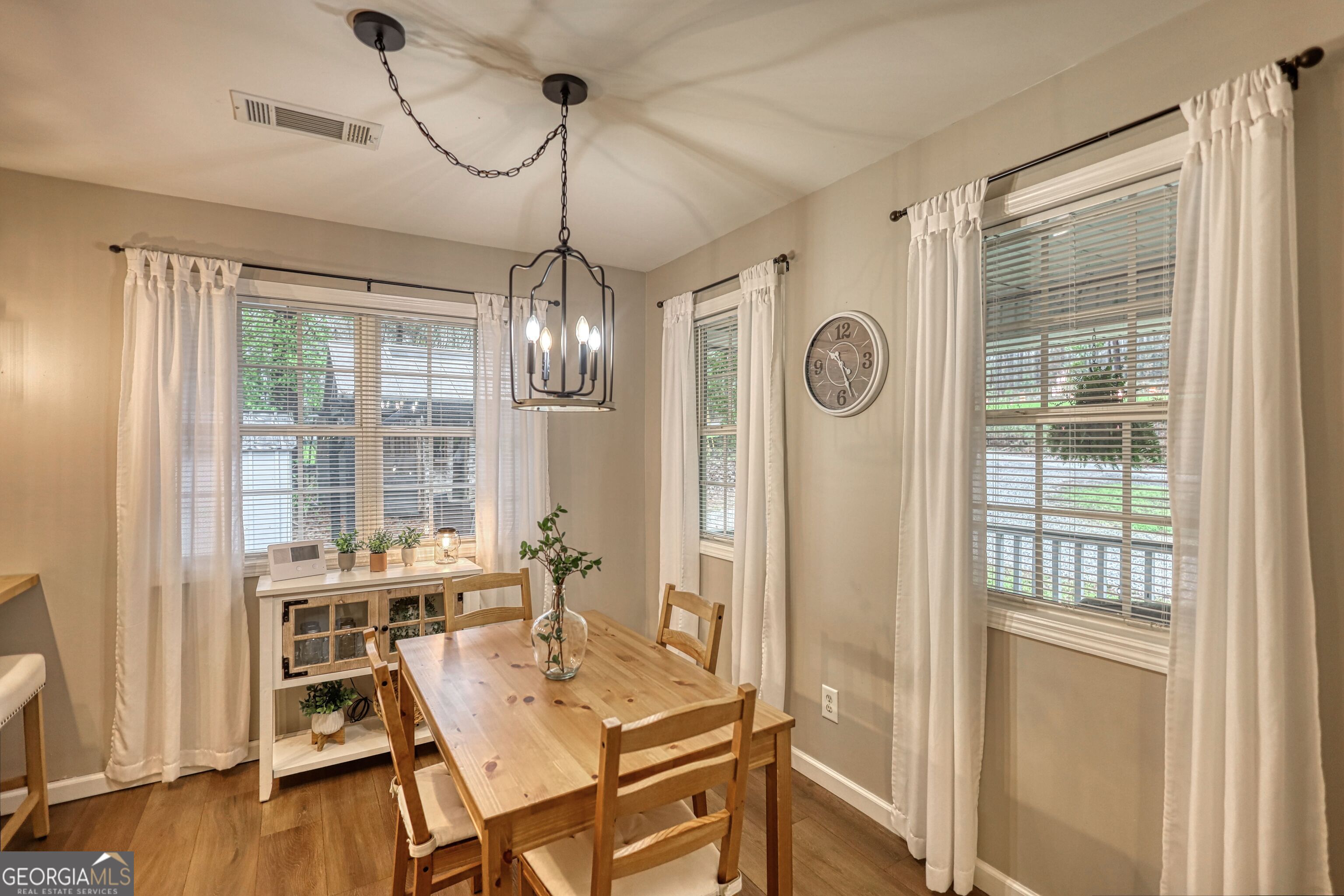 30 Waters Street Monticello, GA 31064 - Photo 18 of 40 a view of a dining room with furniture window and wooden floor