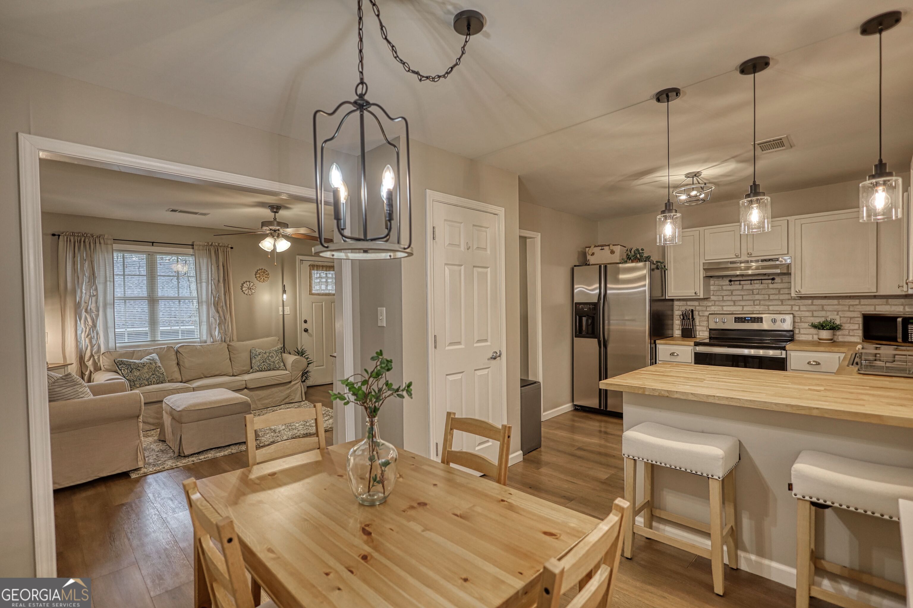 30 Waters Street Monticello, GA 31064 - Photo 19 of 40 a large kitchen with a table and chairs