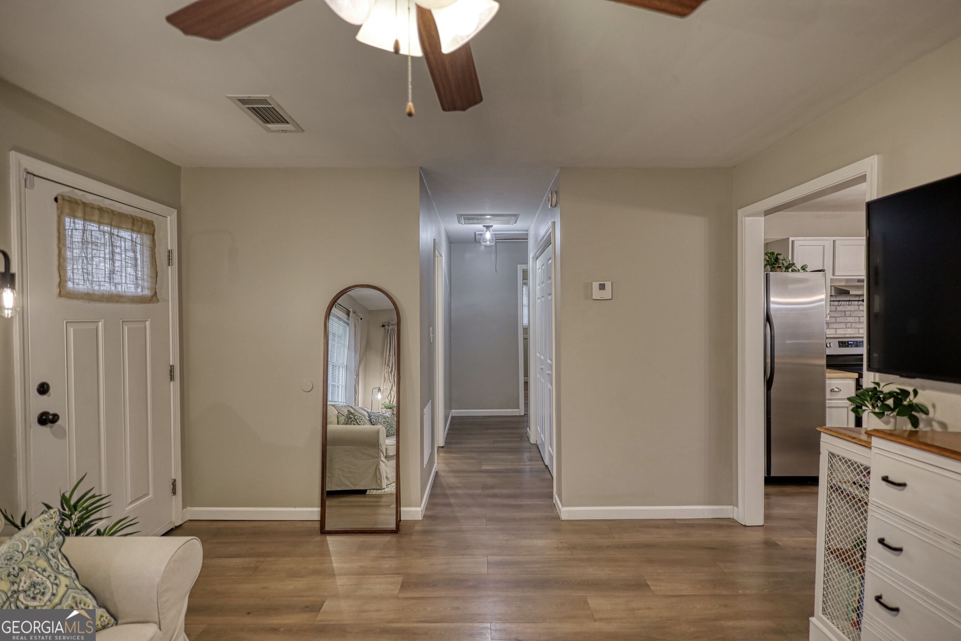 30 Waters Street Monticello, GA 31064 - Photo 20 of 40 a view of a livingroom with wooden floor and closet