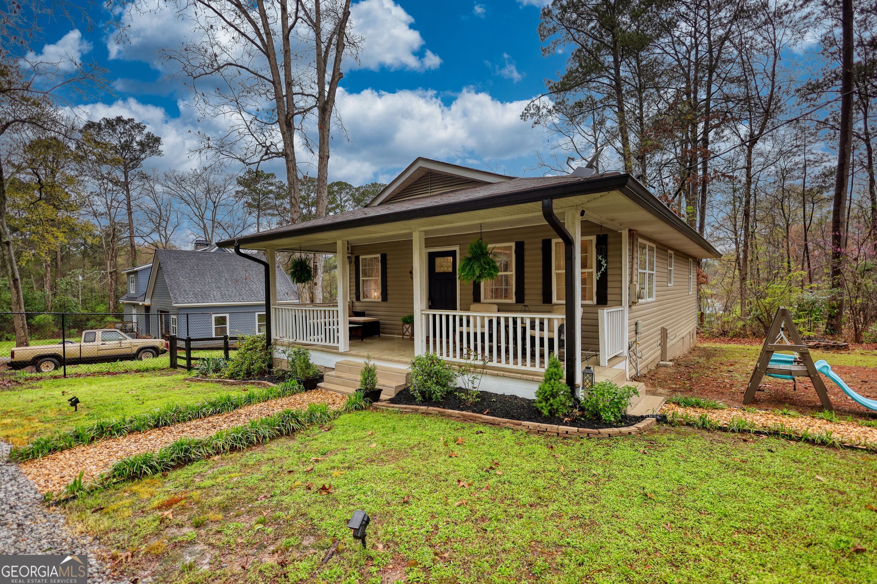 30 Waters Street Monticello, GA 31064 - Photo 2 of 40 a view of a house with a yard and large tree