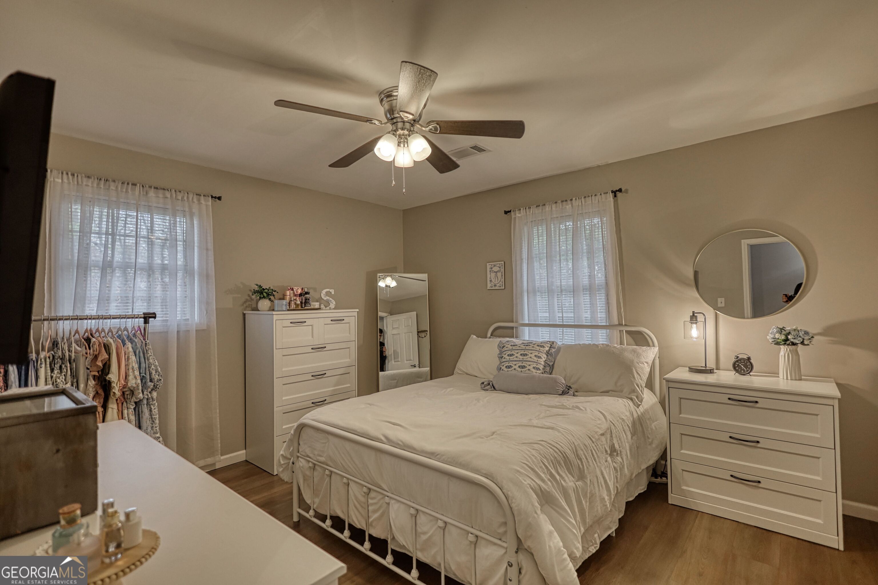 30 Waters Street Monticello, GA 31064 - Photo 21 of 40 a bedroom with a bed and a flat screen tv