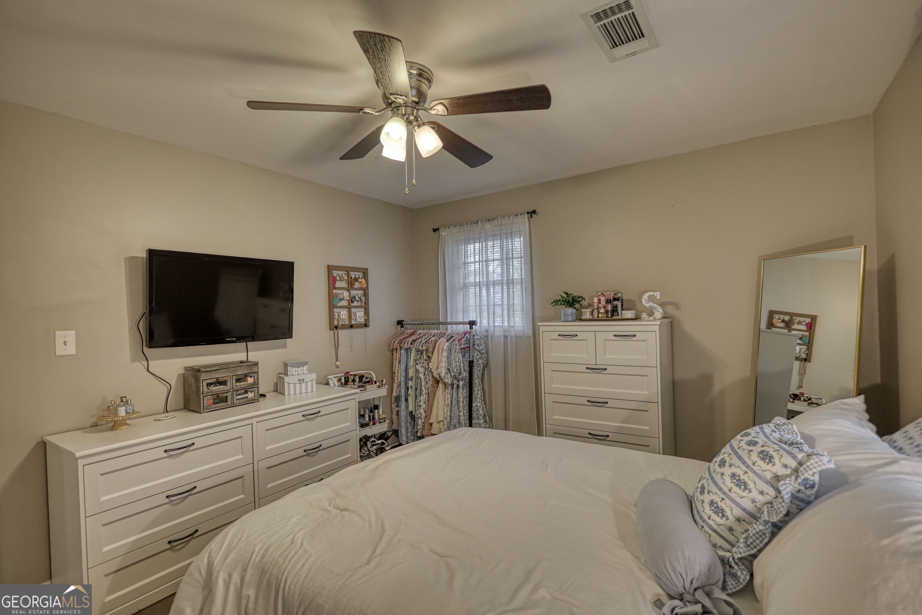 30 Waters Street Monticello, GA 31064 - Photo 22 of 40 a bedroom with a bed and a flat screen tv