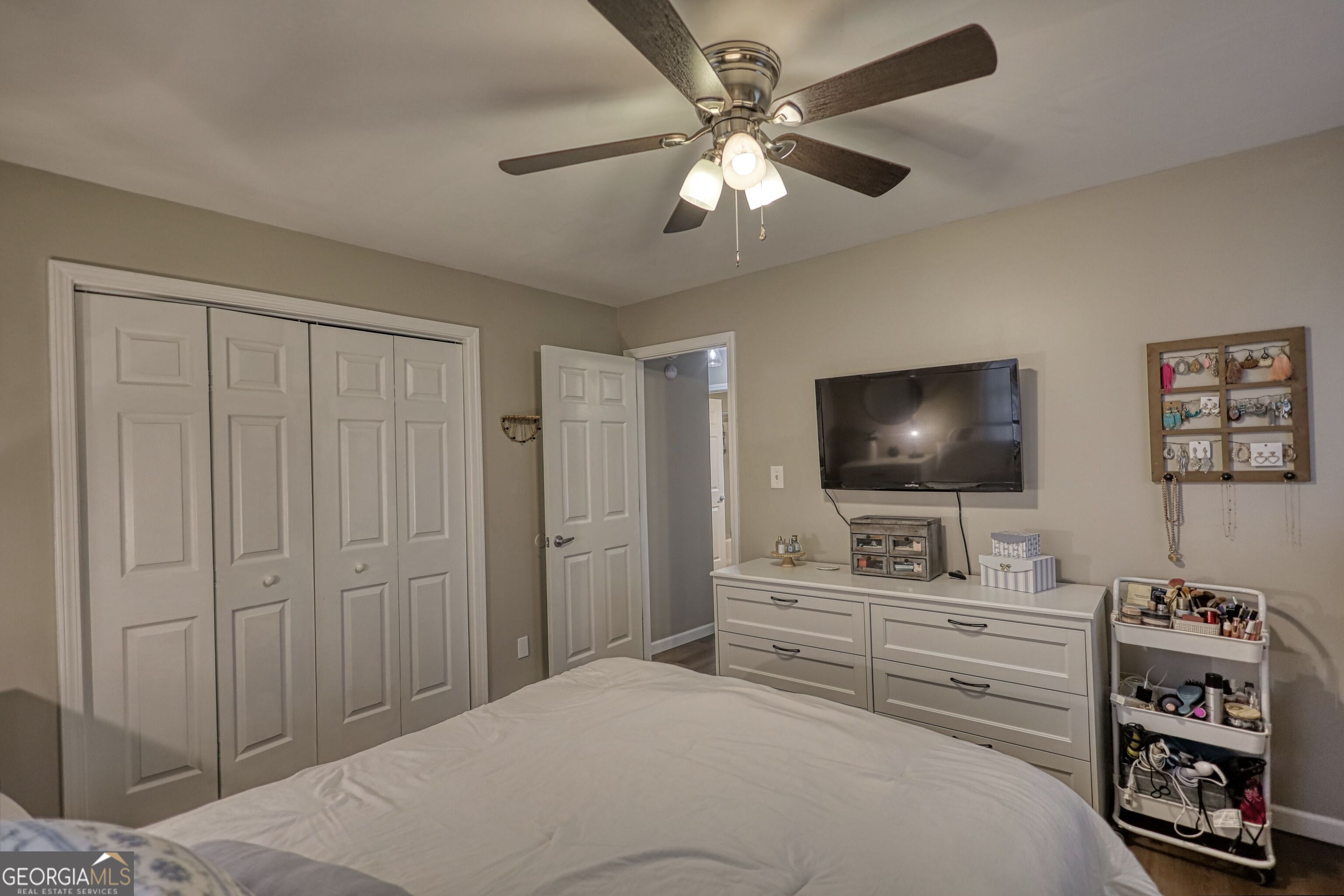 30 Waters Street Monticello, GA 31064 - Photo 23 of 40 a bedroom with a bed and a flat screen tv