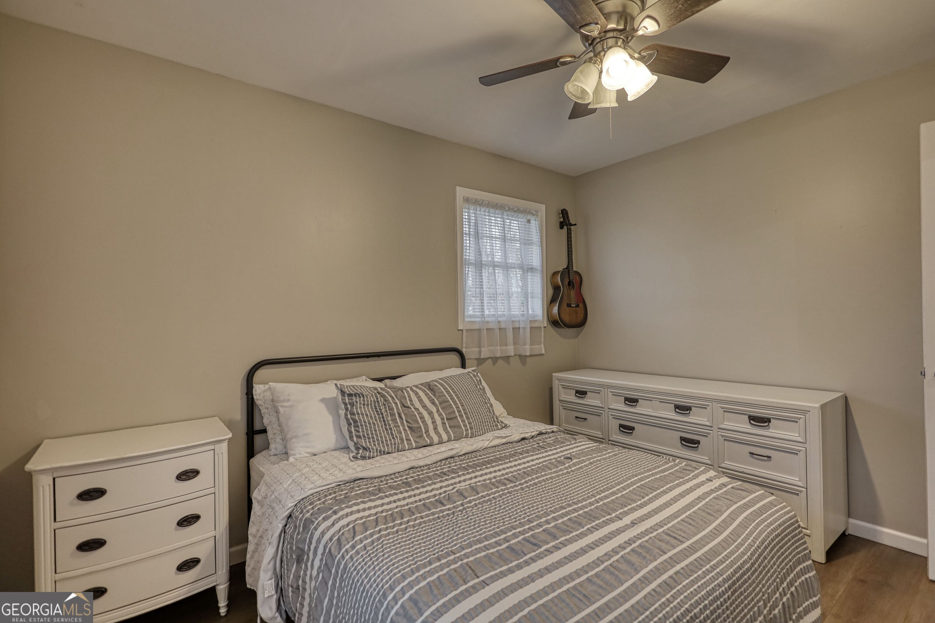 30 Waters Street Monticello, GA 31064 - Photo 24 of 40 a bedroom with a bed and a cabinet