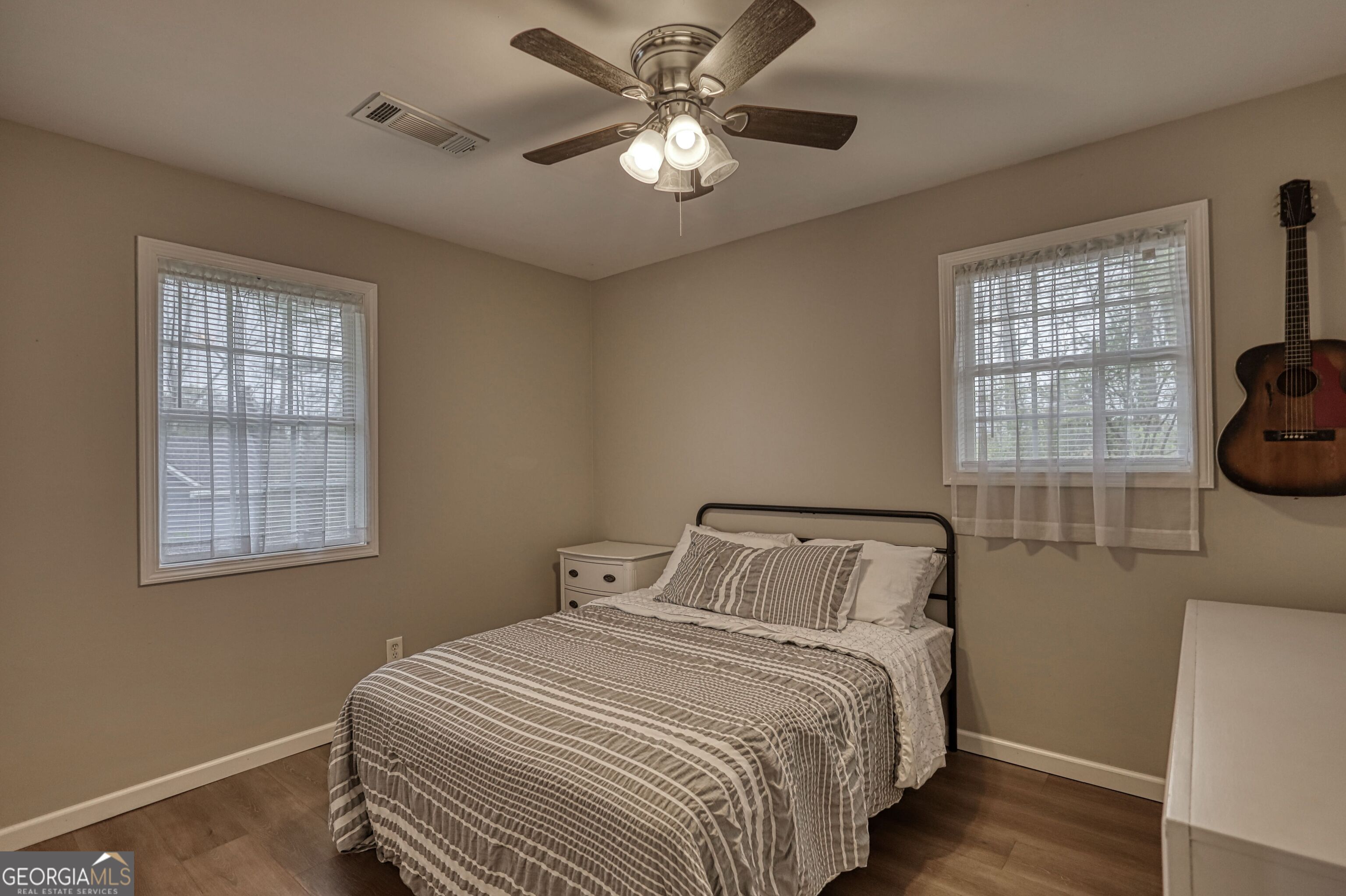 30 Waters Street Monticello, GA 31064 - Photo 25 of 40 a bedroom with a bed and a window