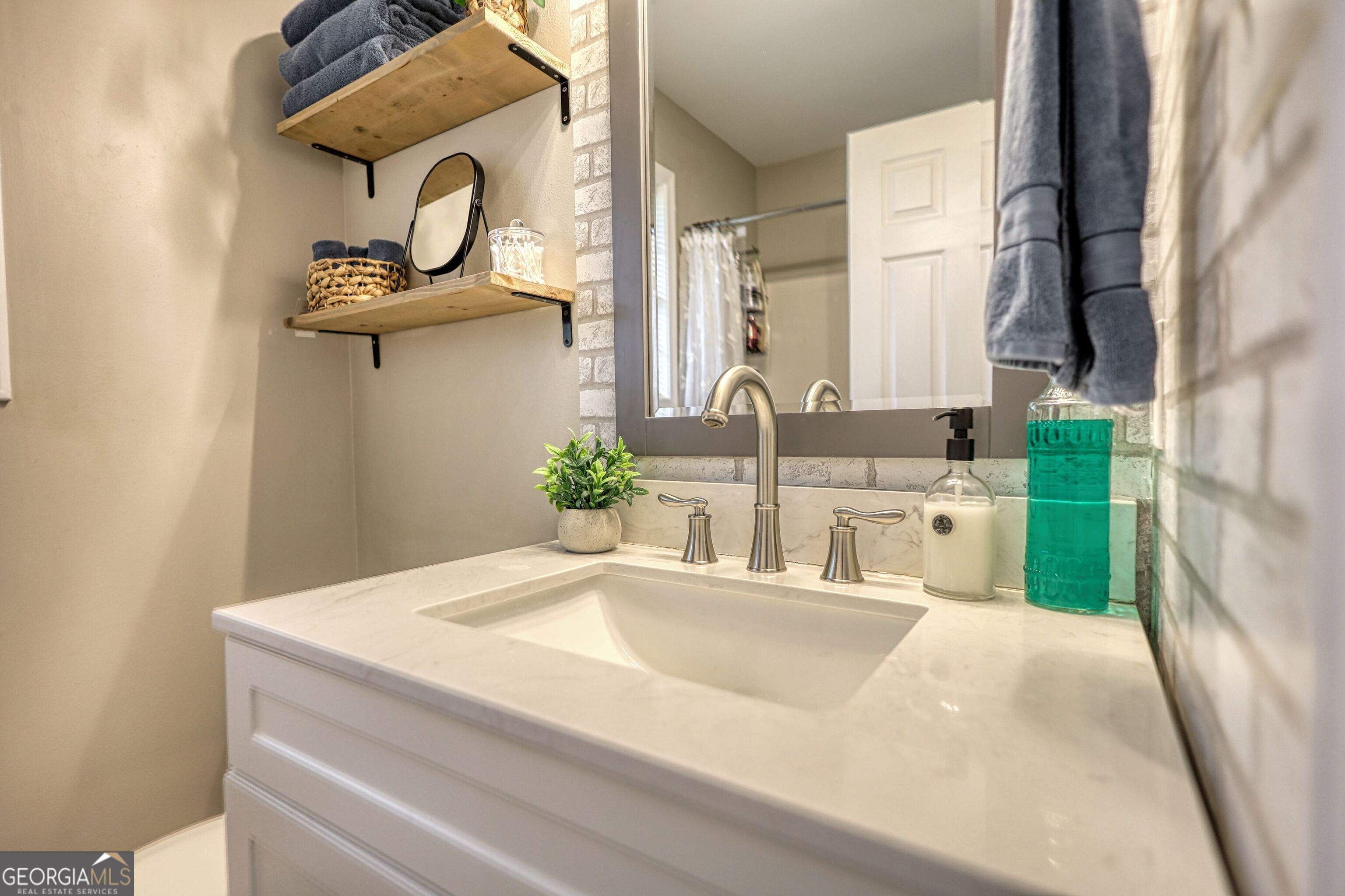 30 Waters Street Monticello, GA 31064 - Photo 27 of 40 a bathroom with a sink and a mirror