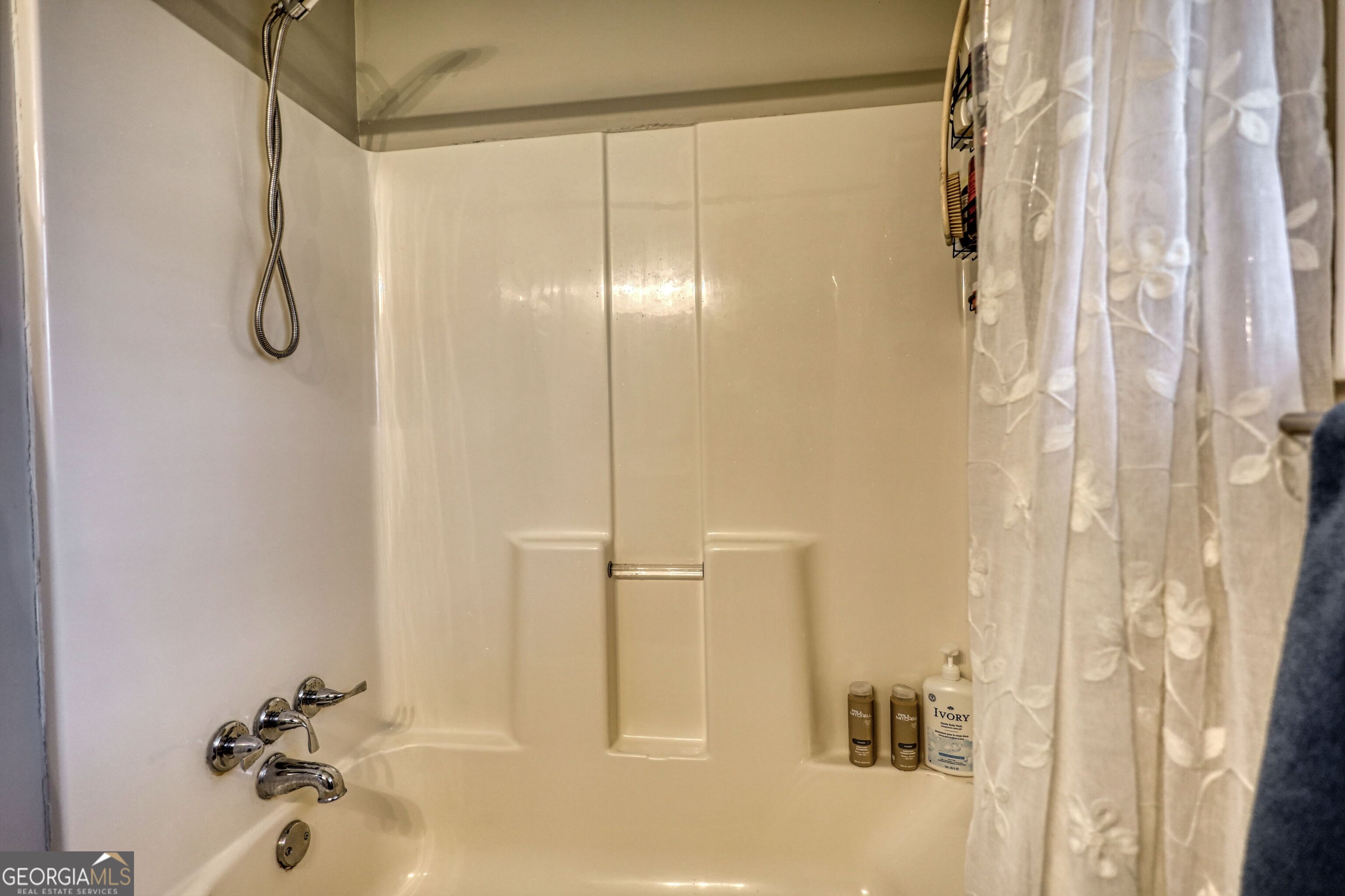 30 Waters Street Monticello, GA 31064 - Photo 28 of 40 a bathroom with a glass shower door