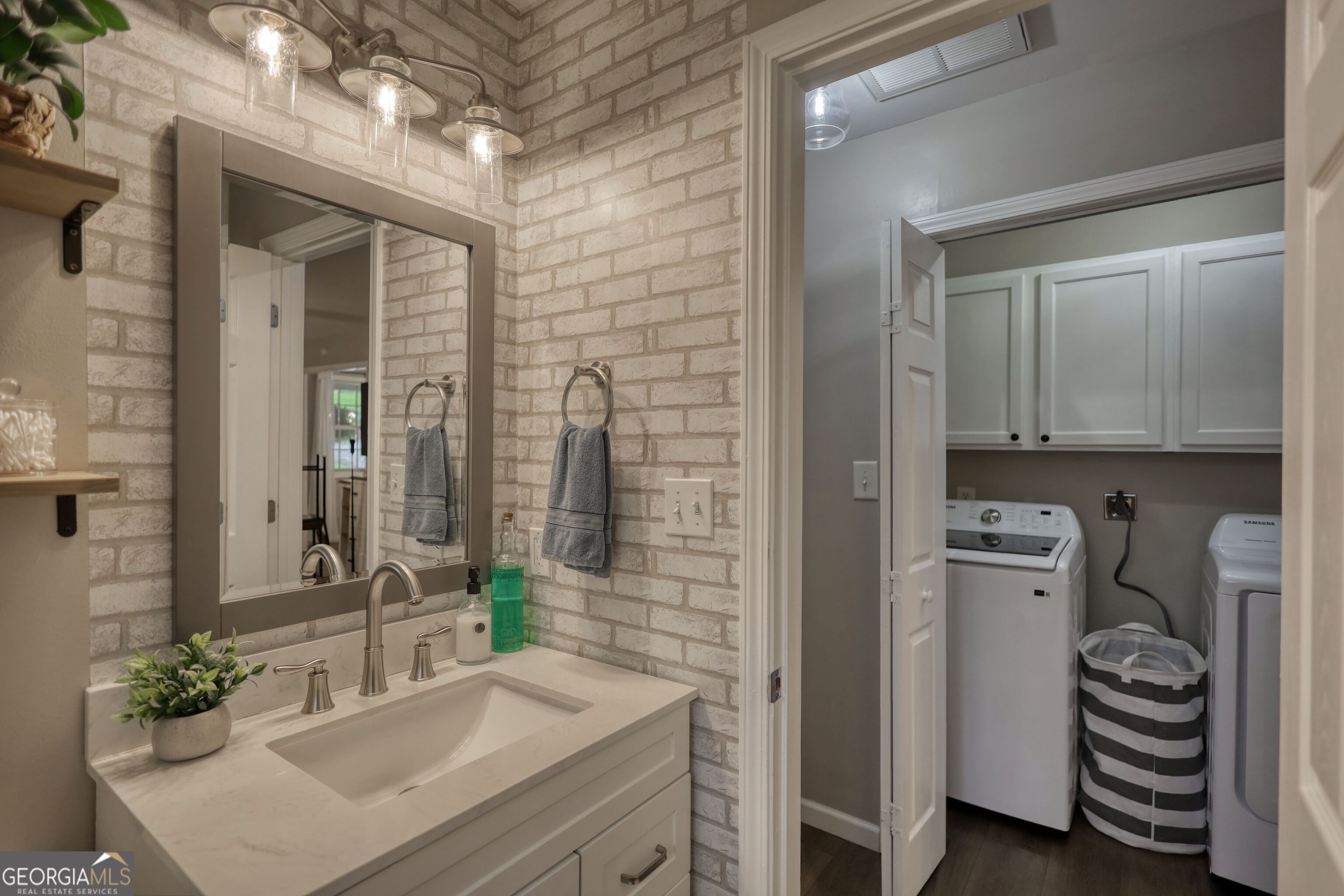 30 Waters Street Monticello, GA 31064 - Photo 29 of 40 a bathroom with a sink a mirror and a shower