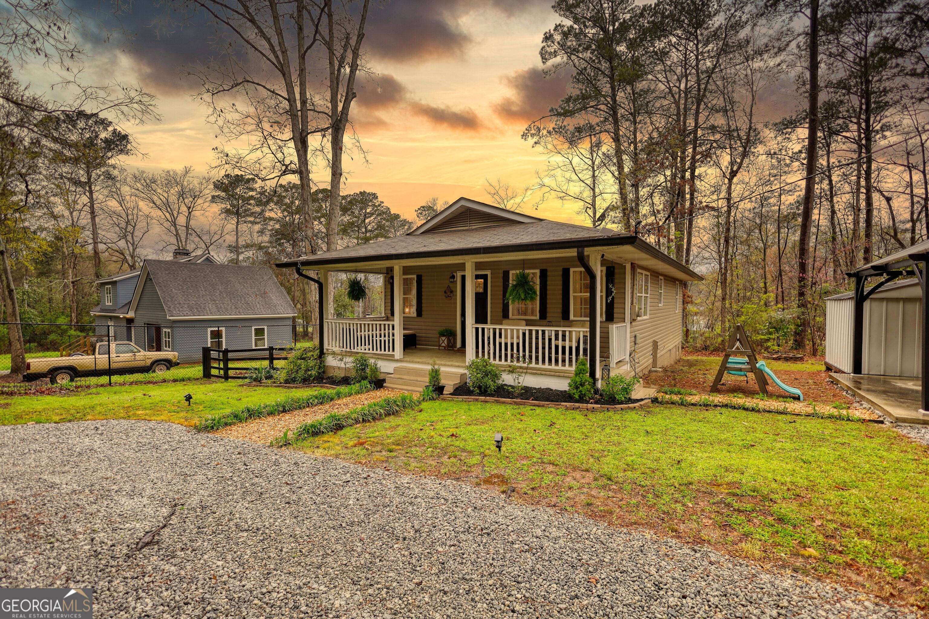 30 Waters Street Monticello, GA 31064 - Photo 3 of 40 a view of a house with a yard and sitting area