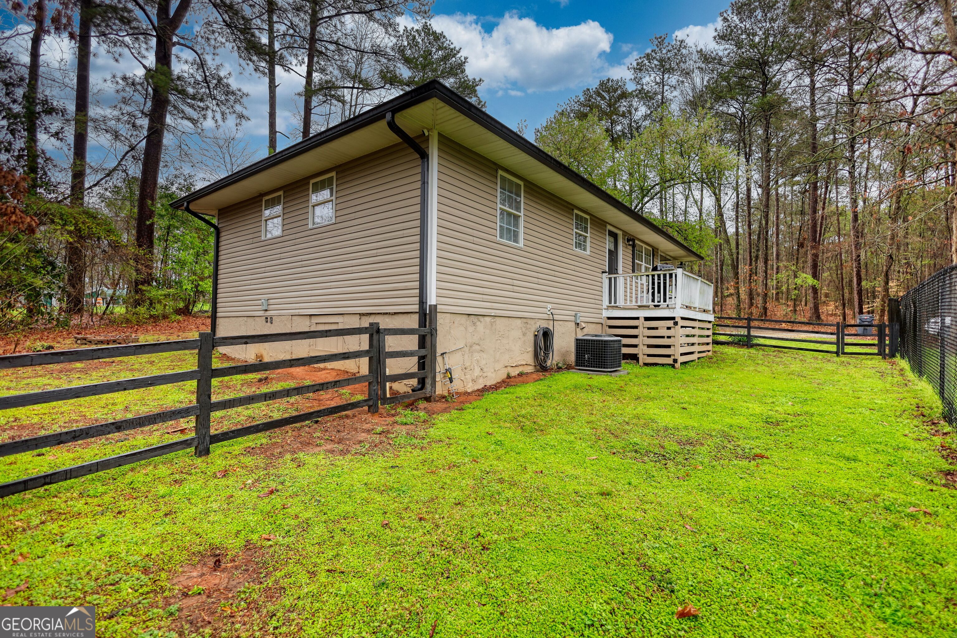 30 Waters Street Monticello, GA 31064 - Photo 36 of 40 a front view of a house with a garden