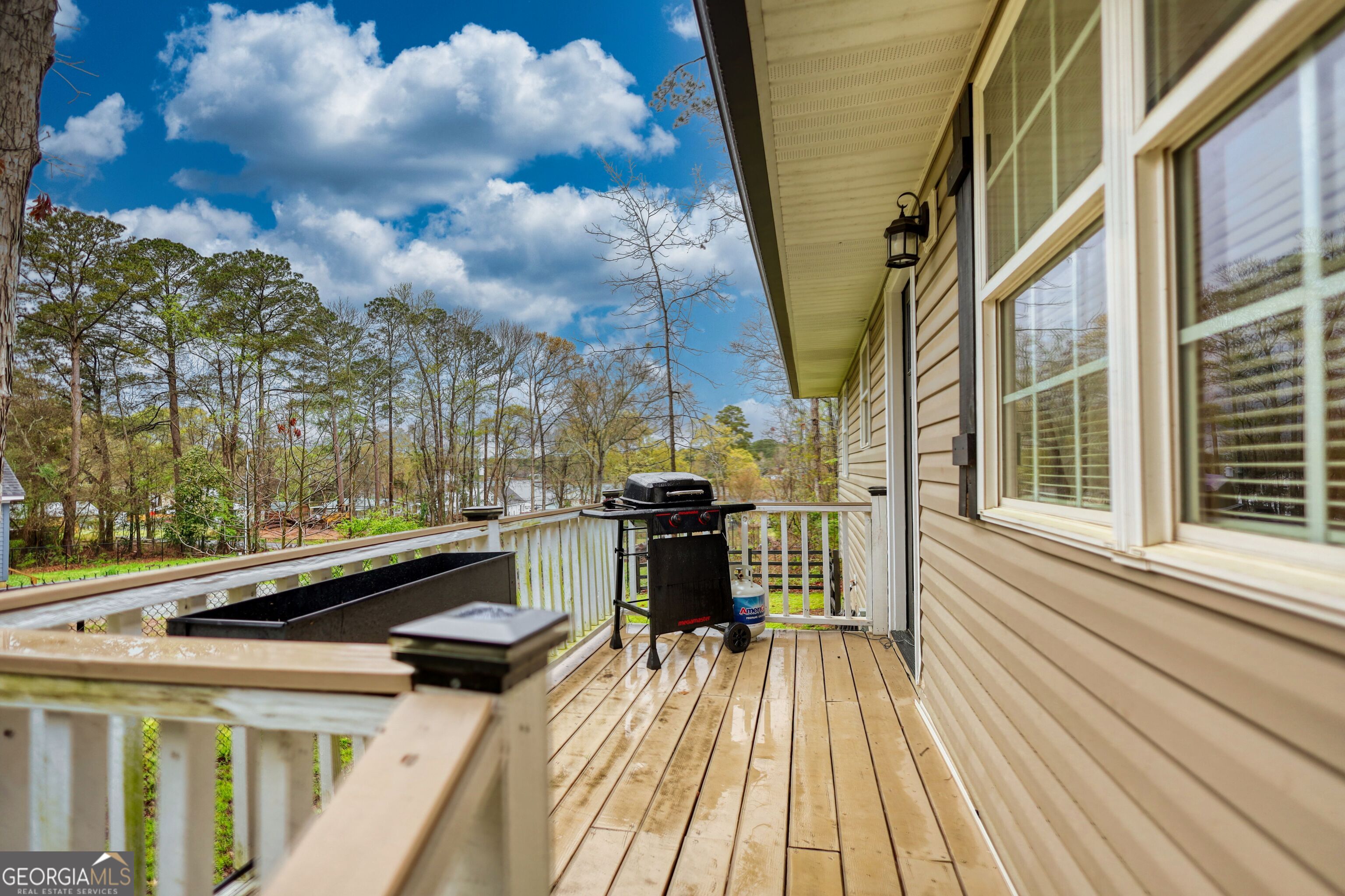 30 Waters Street Monticello, GA 31064 - Photo 38 of 40 a view of a patio with chairs next to a yard