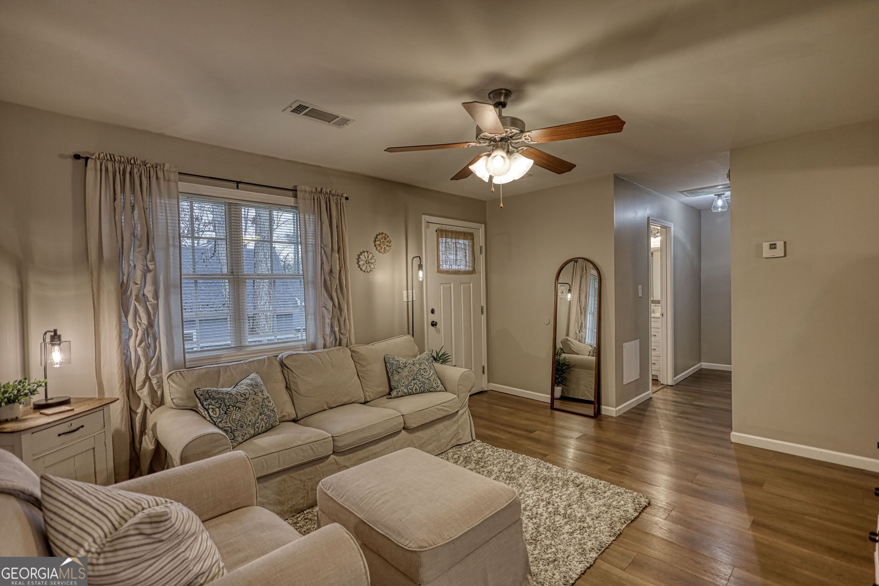 30 Waters Street Monticello, GA 31064 - Photo 4 of 40 a living room with furniture and a large window