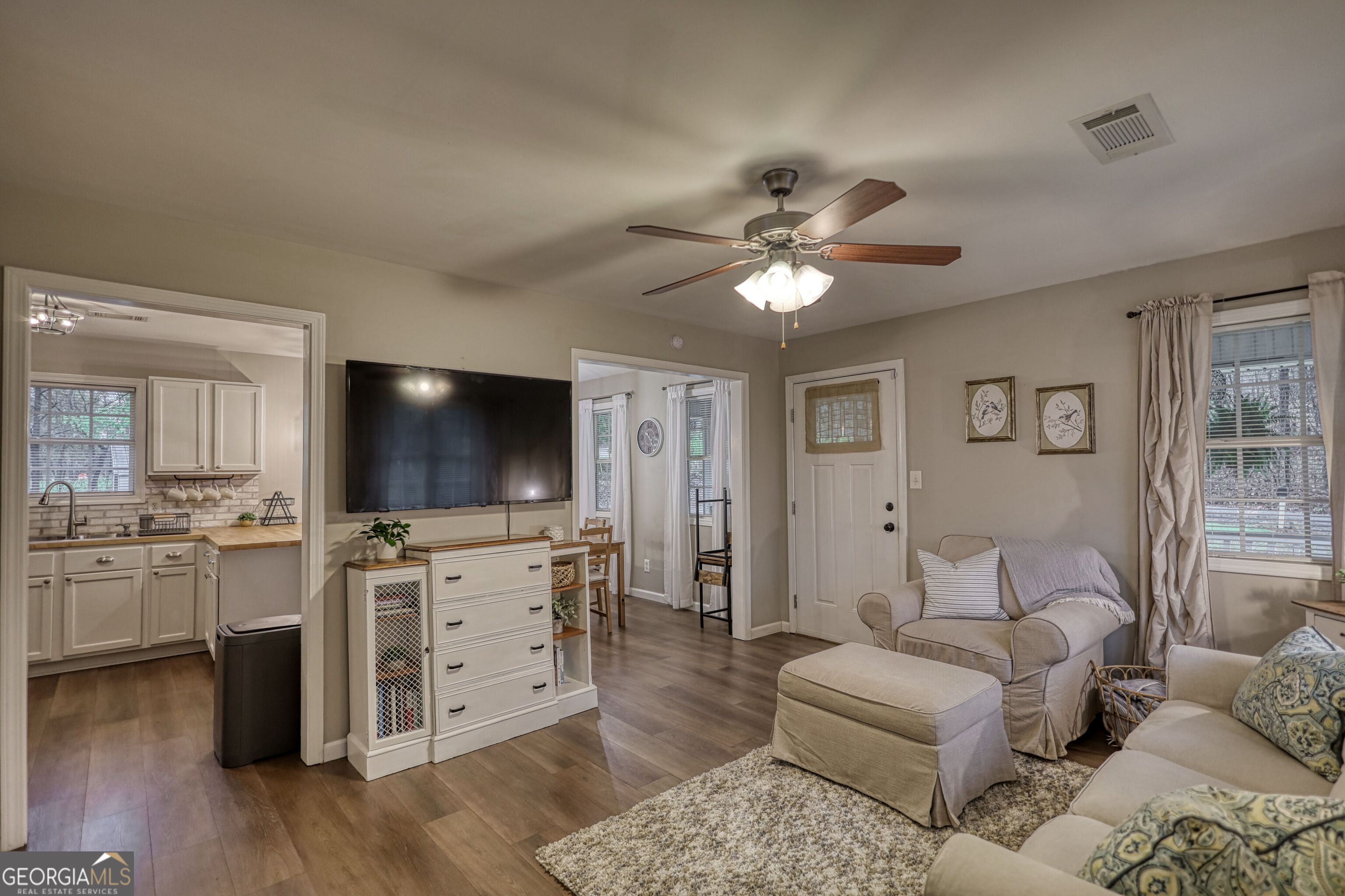 30 Waters Street Monticello, GA 31064 - Photo 6 of 40 a living room with furniture and a flat screen tv
