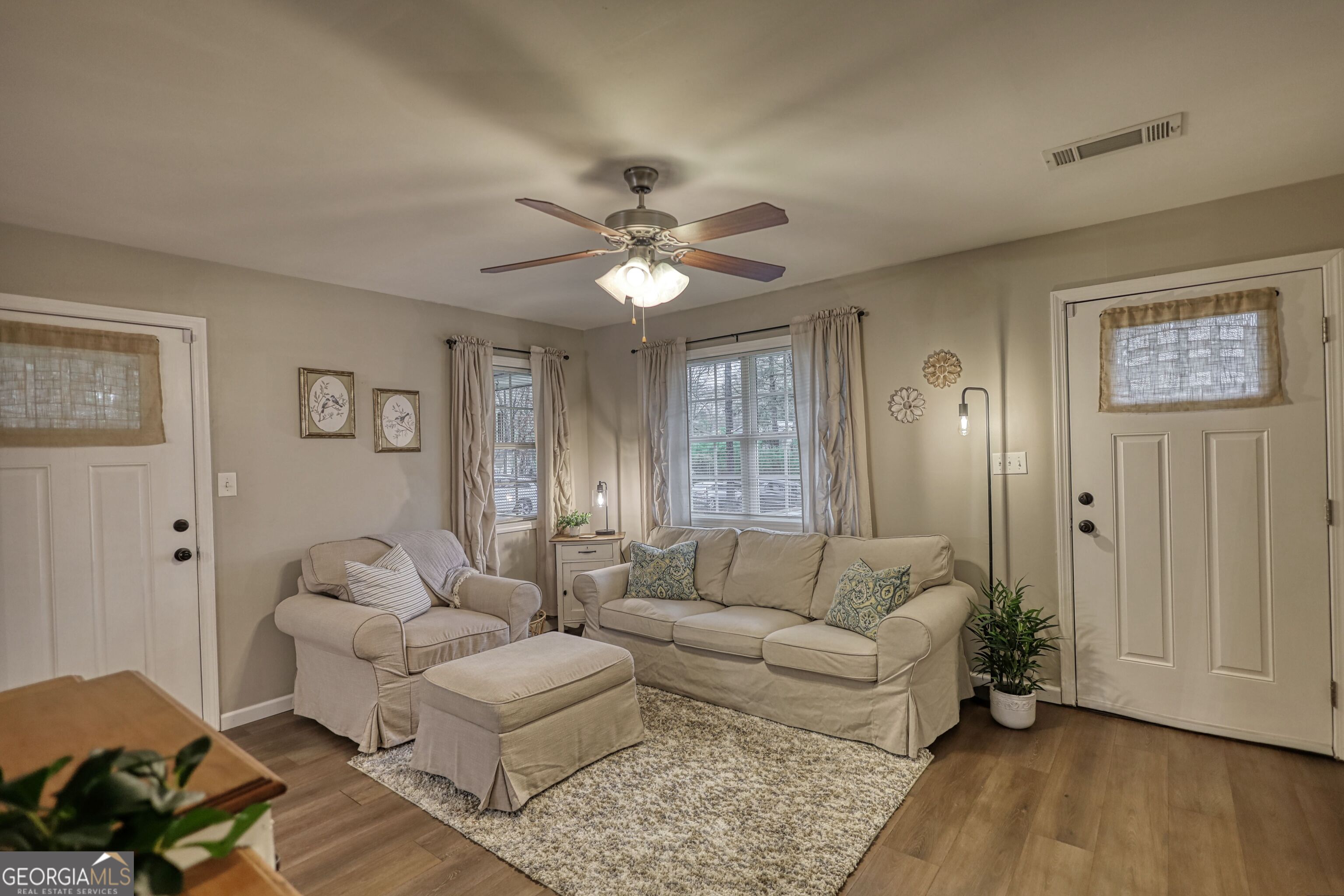 30 Waters Street Monticello, GA 31064 - Photo 7 of 40 a living room with furniture and wooden floor
