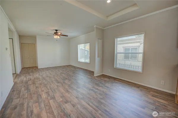 wooden floor in an empty room with a window