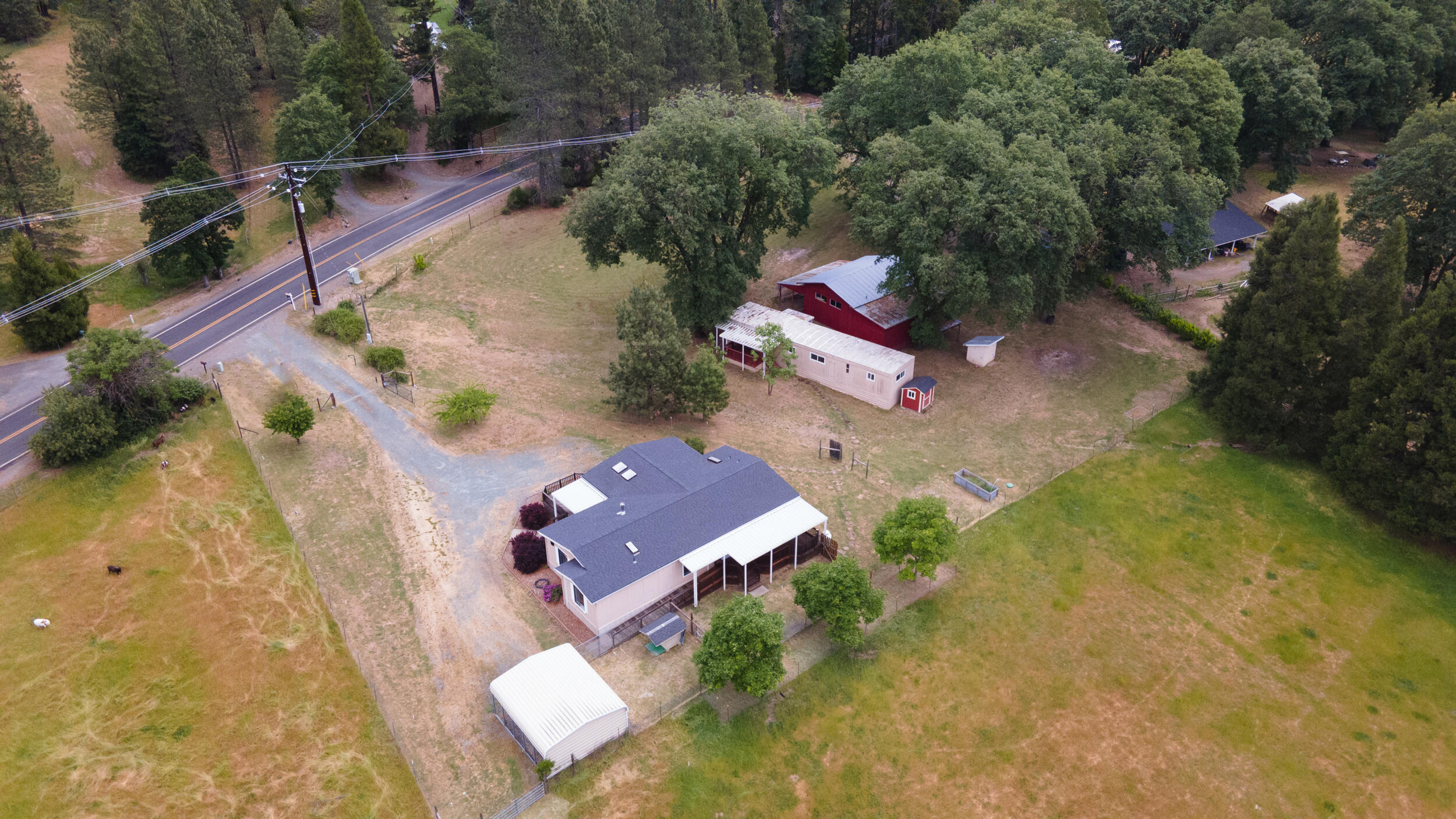 2720 Hugo Road Merlin, OR 97532 - Photo 5 of 38 from left to right: carport, 3 bd 2 bath home, 2 bd 1 bath home, barn/shop/garage with a full bathroom