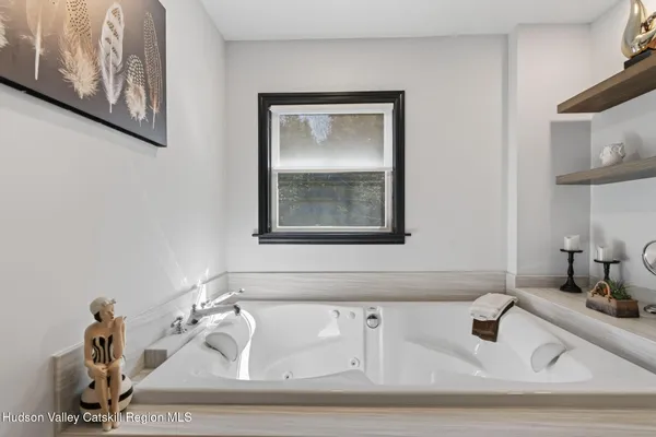 a bathroom with sink and mirror