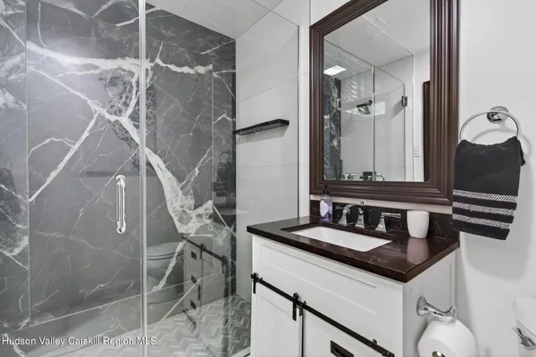 a bathroom with a sink and a mirror