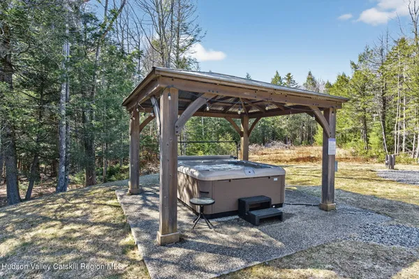a view of a wooden deck with a backyard