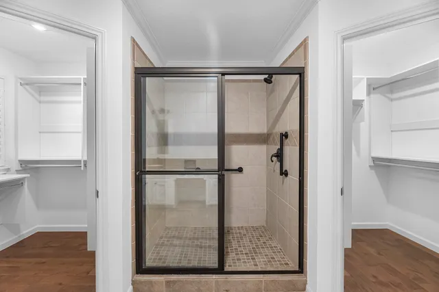 a bathroom with a glass shower door