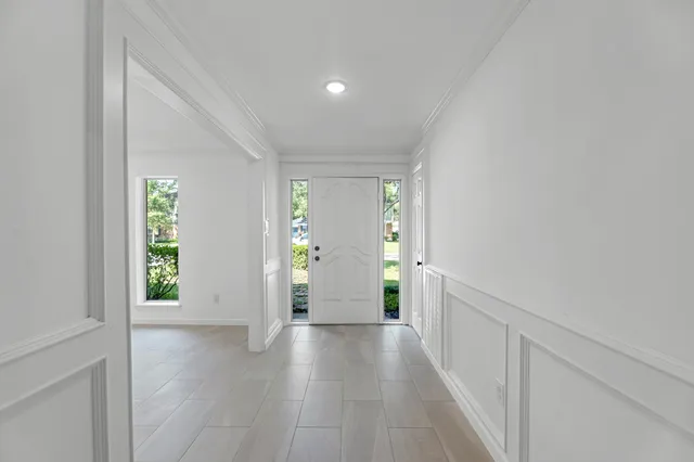 a view of an entryway with wooden floor
