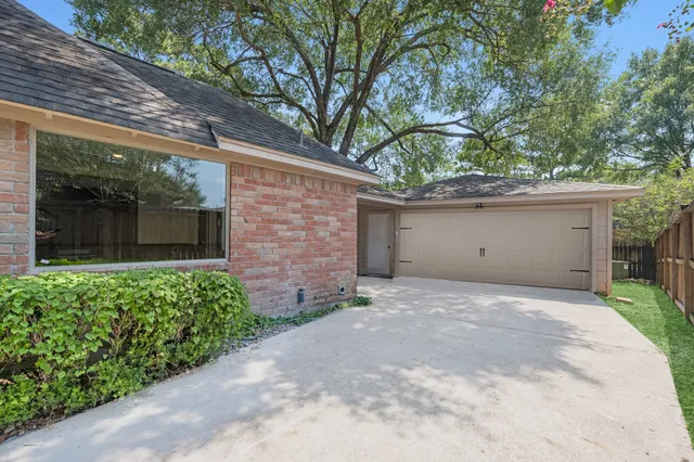 a front view of a house with a garage