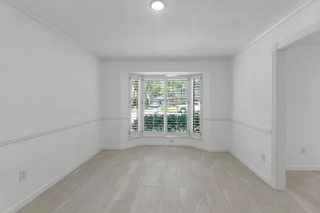 a view of a room that has a window in it