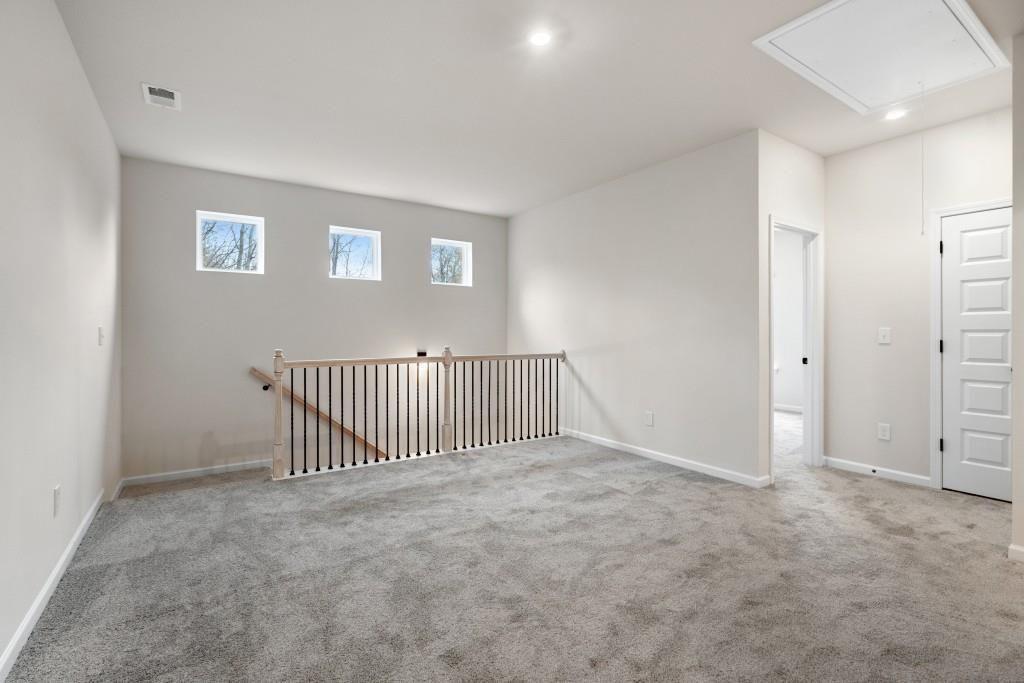154 Red Oak Lane Calhoun, GA 30701 - Photo 21 of 36 an empty room with windows