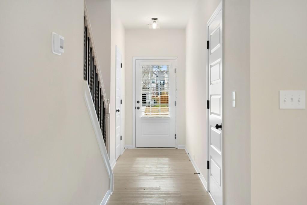 154 Red Oak Lane Calhoun, GA 30701 - Photo 4 of 36 a view of a hallway with a white walls and stairs