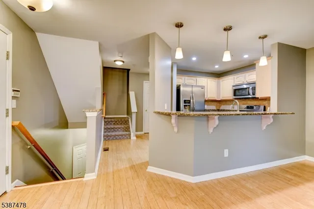 a view of kitchen and wooden floor