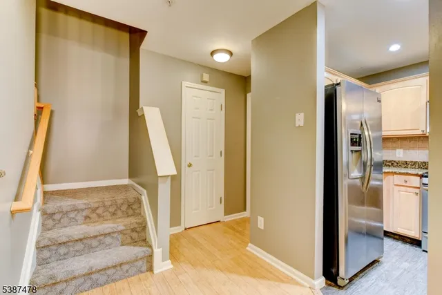 a view of an entryway with kitchen