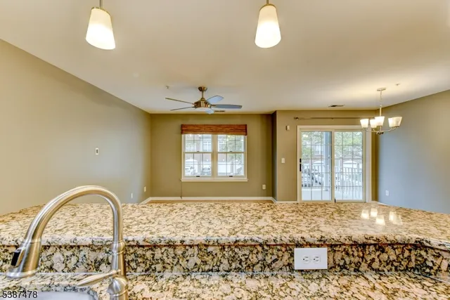 a view of a livingroom with wooden floor and outdoor space