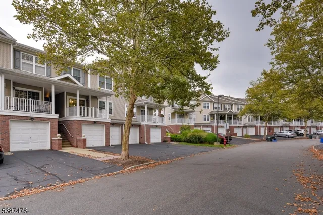 a city street lined with buildings and trees