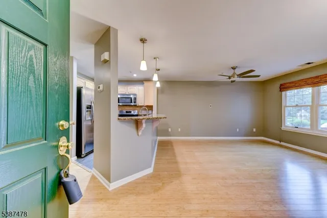a view of a kitchen with furniture and a window