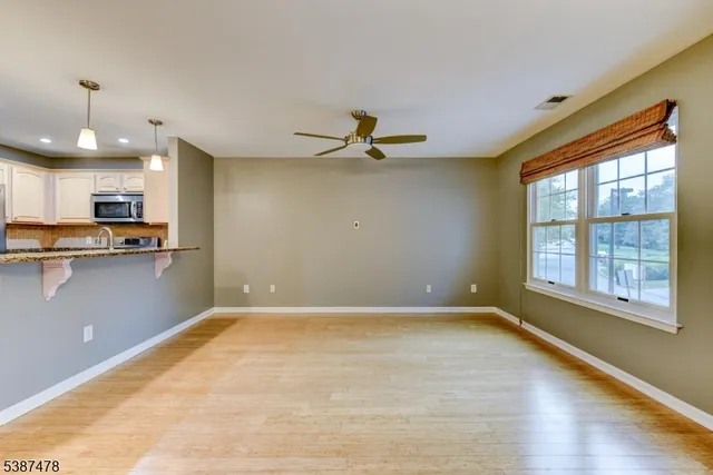 a view of a kitchen with a sink and a window