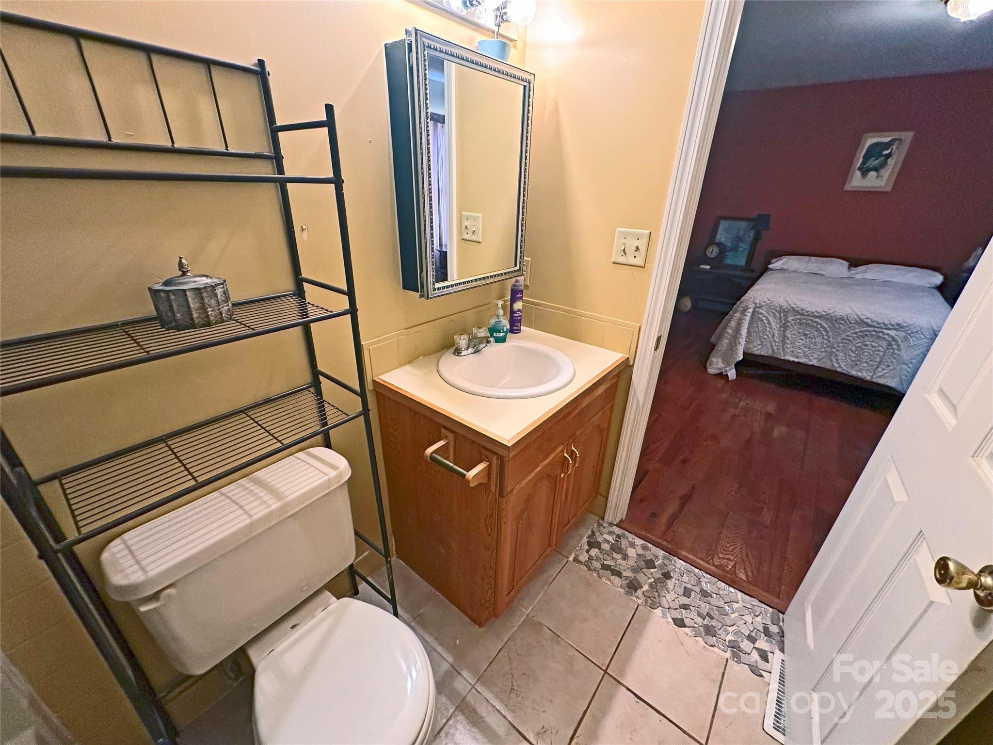 3603 Ritchie Road Lincolnton, NC 28092 - Photo 11 of 44 a bathroom with a toilet sink and mirror