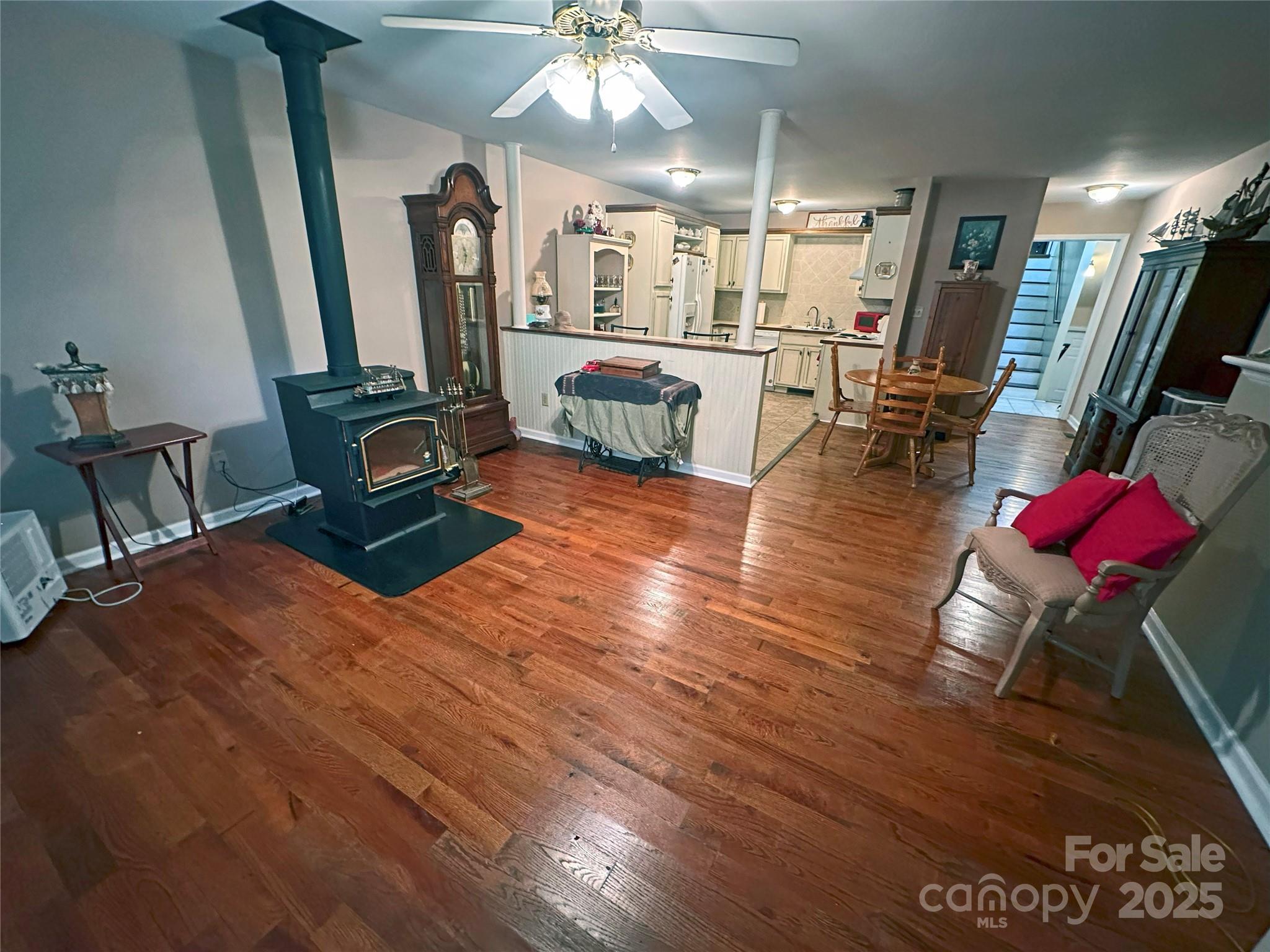3603 Ritchie Road Lincolnton, NC 28092 - Photo 2 of 44 a living room with furniture a fireplace and wooden floor
