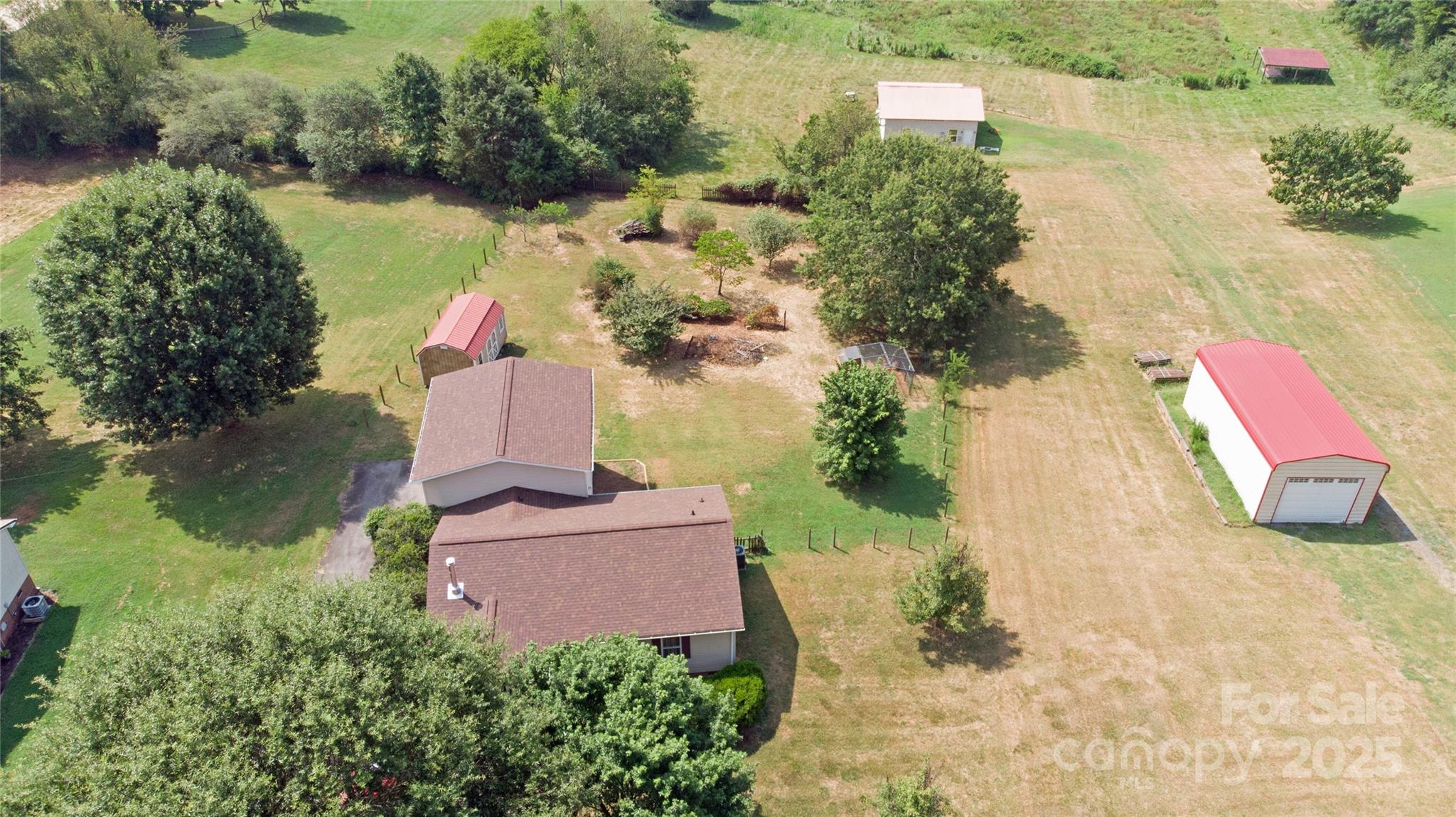3603 Ritchie Road Lincolnton, NC 28092 - Photo 30 of 44 an aerial view of a house with a yard and lake view