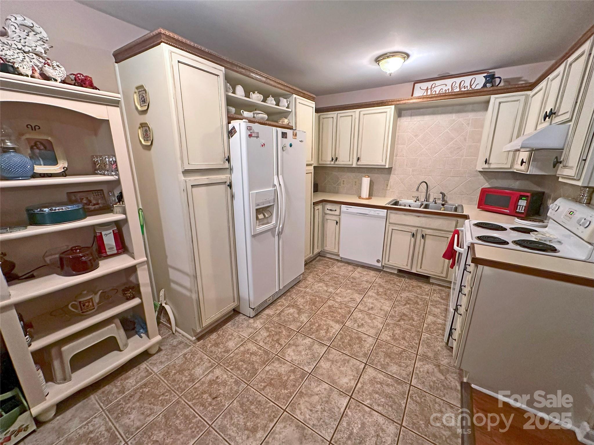 3603 Ritchie Road Lincolnton, NC 28092 - Photo 34 of 44 a kitchen with stainless steel appliances a refrigerator and cabinets