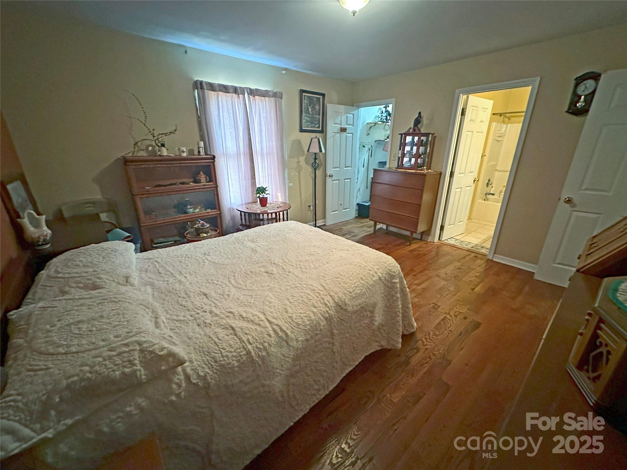 3603 Ritchie Road Lincolnton, NC 28092 - Photo 38 of 44 a bedroom with a bed and wooden floor